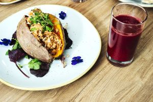 Our baked Sweet Potato with a sundried hummus filling with a Red Rocket Fuel Juice. at Soul Food Kitchen in Glasgow