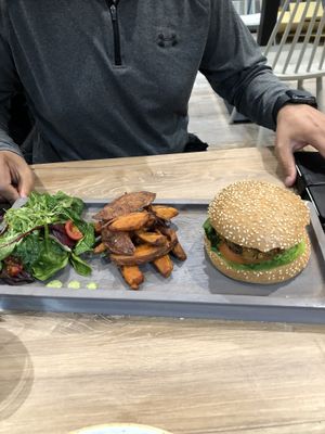 Vegan burger with sweet potatoe chips and salad.  at Soul Food Kitchen in Glasgow