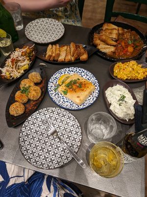 Fried feta cheese, cheese balls, potato salad, tzatziki, spicy cheese cream, vegan sausage i tomato sauce, at Tarantula in Thessaloniki