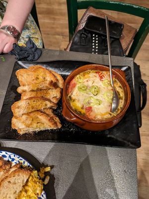 Melted feta cheese pot with tomatoes, so good! at Tarantula in Thessaloniki