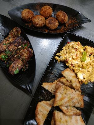 Tempeh, cheese balls and cheese dip with bread. at Tarantula in Thessaloniki