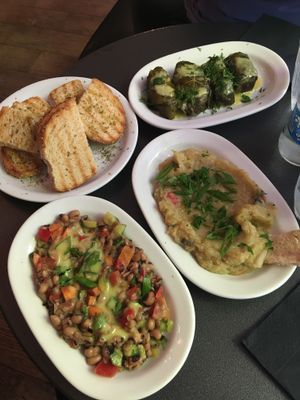 We had the aubergine salad, bread, black eyed beans and most perfectly dolmadakia which are wine leafs filled with rice and some sauce!! at Tarantula in Thessaloniki