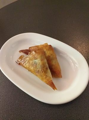 tiropitakia (fired cheese pies with red pepper, herbs and linseed) at Tarantula in Thessaloniki