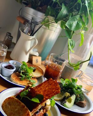 Left: Bagel with Cream Cheese & Jam - Centre: Waffle Stack - Right: Tofu Scramble at Flora by Greenhouse Canteen in West End