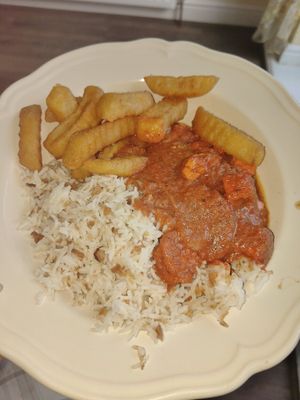 Tofu tikka masala, garlic rice n chips 😛 at Karma Kitchen Cafe in Newcastle Upon Tyne