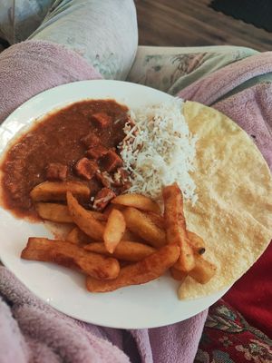 Tofu tikka masala, garlic rice, chips n poppadom 🍛 at Karma Kitchen Cafe in Newcastle Upon Tyne
