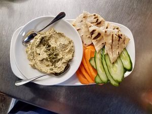 Smoked eggplant and chickpea dip w fresh veg and our homemade flatbread!
 at Flora Hall Brewing in Ottawa