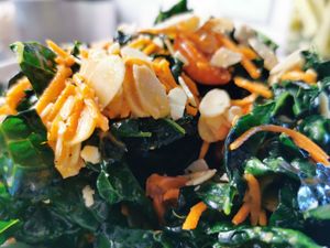 Fall kale salad with roasted tomato, toasted almonds with orange vinaigrette at Flora Hall Brewing in Ottawa