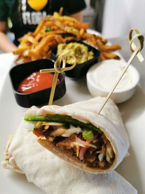 Beer-braised lentil burrito with green cabbage slaw, served with fries or salad. at Flora Hall Brewing in Ottawa