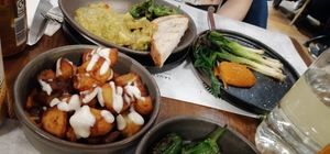 Patatas bravas, lentil dahl, grilled onions, pimientos del padrón at EDO in Belfast