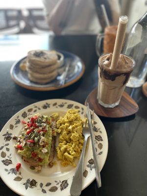 Avo Toast with scrambled tofu, chocolate smoothie, masala pancakes.  at Asa Vegan Kitchen and Studio in Chiang Mai