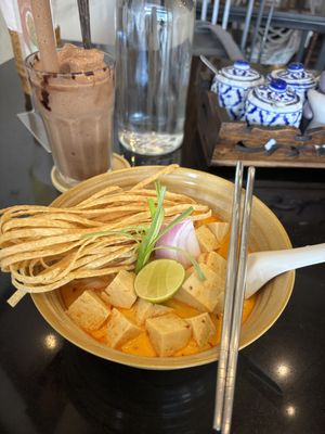 Khao soi and banana cacao smoothie  at Asa Vegan Kitchen and Studio in Chiang Mai