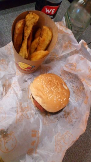 Cheeseburger!!!! Amazing (eaten some of my fries)  at Munchies Tha Phae Gate in Chiang Mai