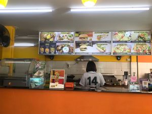 Kitchen and menu. at Munchies Tha Phae Gate in Chiang Mai