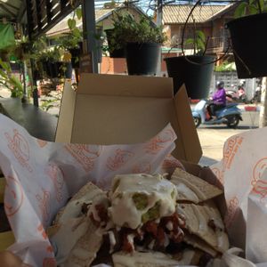 Decently loaded w/ tomatoes, guac, light “sour cream”, and other yummies. Restaurant is on a pretty noisy road. at Munchies Tha Phae Gate in Chiang Mai