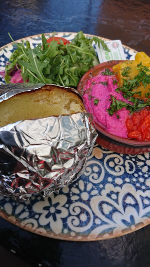 Baked potato with ajvar, hummus, mango, and salad. 145 sek. at Global Living in Vasteras