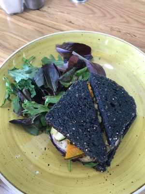 Activated charcoal bread roast vegetable toastie  at The Raw Hub in Mosman
