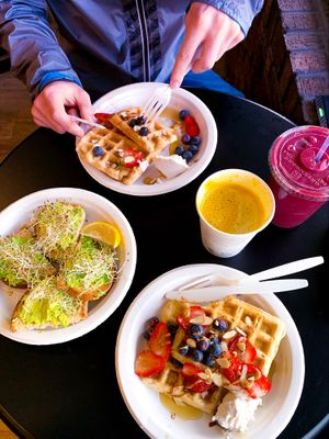 Daily wellness waffles, avocado toast, golden milk latte, açaí+berry smoothie at Plantz Cafe in Dracut