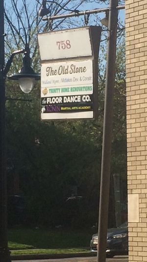 Sign on south Ave in front of parking lot  at The Old Stone Tavern in Rochester