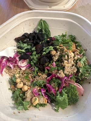 Half eaten protein bowl with tofu, quinoa and chick peas    at sweetgreen - Michigan Ave in Chicago