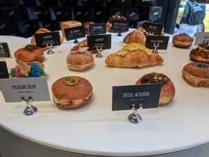Their sweet donuts collection with a Mac and cheese croissant in the middle at Weirdoughs in Melbourne