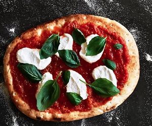 MARGHERITA PIZZA. San Marzano Tomato. Cashew Mozzarella. Basil. Chili Flakes. at Althea in Chicago