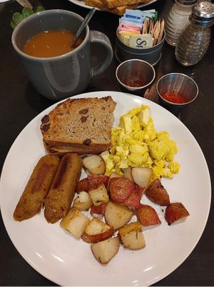 Tofu eggs with roasted potatos and vegan sausage.  Was very good.   Also had a vegan cinnamon bun. 👍...
 at Honey B's in Frankenmuth