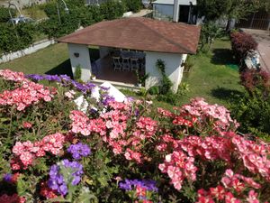 Breakfast in the Gazebo, surrounded by a relaxing garden. at Il Ciliegio in Marzolanella