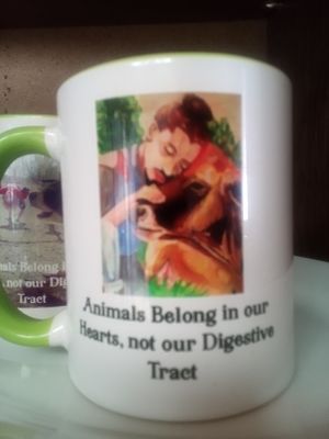 Mugs are available with a rendering of Earthling Ed, hugging a bovine sister
775-460-3969 at Divine Grace Healing Retreats in Reno