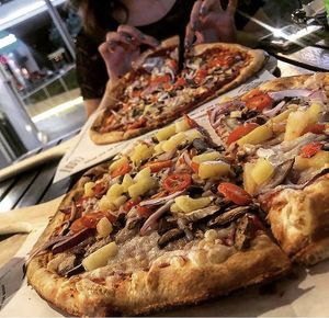 Vegan pizzas with spicy red sauce at The Pizza Press in Las Vegas