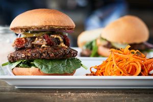 Noble Burger!
Our house-made vegan burger topped with pickles, smoked aioli, truffle infused garlic dijon, baby spinach, herb roasted cherry tomatoes, roasted portobello and bermud at Delicious Raw Kitchen and Juice Bar - Pine Ridge Rd in Naples