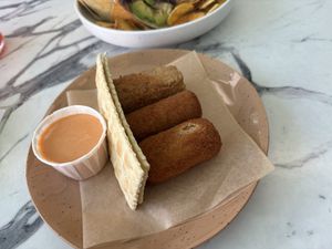 Croquetas! The two that look alike are the ham and cheese and the third is the chickpea   at Vegan Cuban Cuisine in Miami