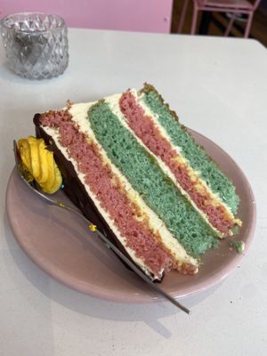 Rainbow cake with peach and lemon (the cake is quite hard and very sweet with a lack of flavour) at Deer Mama in Amsterdam