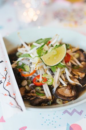 Pho, vietnamese soup with rice noodles, shiitake mushrooms, lime, bean sprouts, chili, spring onions & green herbs at Deer Mama in Amsterdam