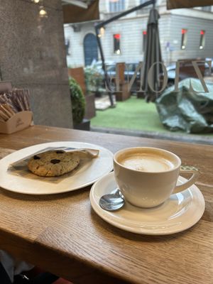 Soy milk cappuccino and a cookie with raisins  at Panettoni Giovanni Cova in Milan