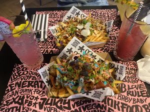 „Happi Ribs“ (Back) & „Rainbow Fries“ (Front) at Vegan Junk Food Bar - Downtown in Amsterdam
