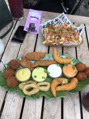 Sumo platter & loaded truffle fries at Vegan Junk Food Bar - Downtown in Amsterdam