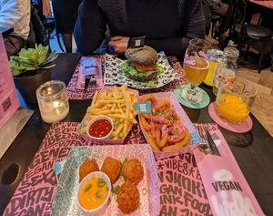 Burger, onion rings, fries, Mac n cheeze balls at Vegan Junk Food Bar - Downtown in Amsterdam