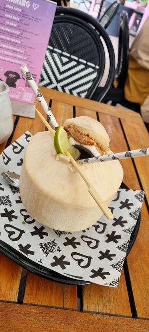 a fresh coconut with lime and nothing else, perfect sweet snack and refreshing drink at Vegan Junk Food Bar - Downtown in Amsterdam
