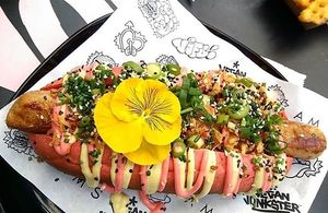 An amazing sausage by Beyond Meat murdered with way too much crappy sauce.  at Vegan Junk Food Bar - Downtown in Amsterdam