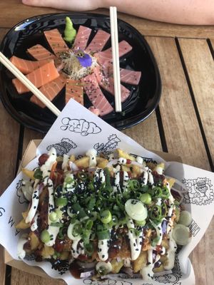 vegan 12 piece sashimi of tuna and salmon and fried chicken dirty fries  at Vegan Junk Food Bar - Downtown in Amsterdam