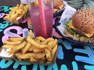 Original burger, truffle fries, tipsy unicorn drink at Vegan Junk Food Bar - Downtown in Amsterdam