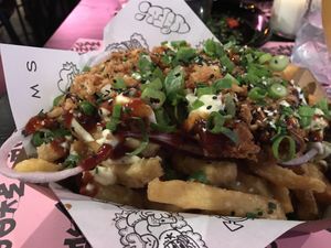 Delicious loaded fries! A bit over cooked but the toppings were amazing  at Vegan Junk Food Bar - Downtown in Amsterdam