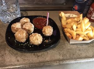 Coconut curry bitterbals & normal fries with garlic sauce at Vegan Junk Food Bar - Downtown in Amsterdam