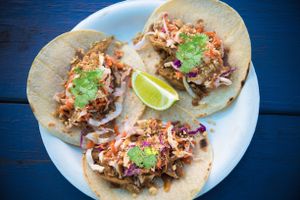 Vegan Thai Chicken Tacos with rainbow coleslaw, crushed peanuts, house-made peanut sauce & fresh coriander. at Earth Aloha Eats - Waikiki in Honolulu