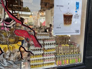 Window with poster of coconut latte  at STACH food in Utrecht