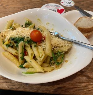 CREMA DI AVOCADO - Vegan pasta with cherry tomatoes, bell peppers, rucola and onions all mixed with a dash of blended avocados, topped with vegan melt.  at Vapiano - Solaris in Tallinn
