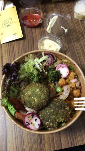 Inferno protein bowl with plastic forks and plastic containers at Nut and Bowls in New Delhi