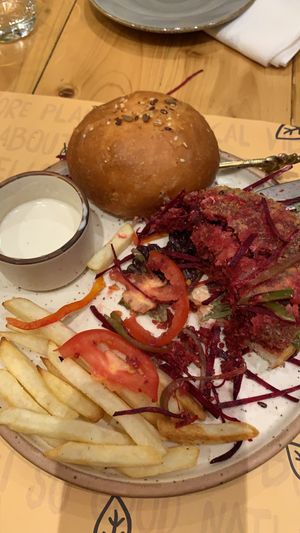 Dry pre-cut veggies in burger and very average fries  at Nut and Bowls in New Delhi