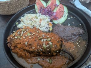 Chile relleno with garbanzo pastor stew and red sauce at Arte Sano in Holbox